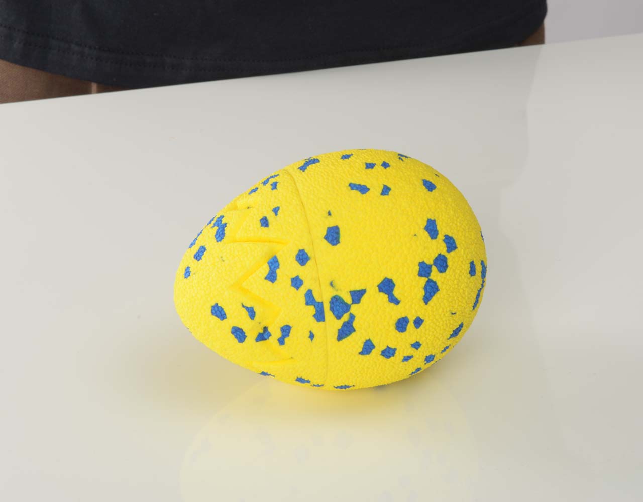 The Zeus NITRO Dragon Egg bouncing on a flat surface.